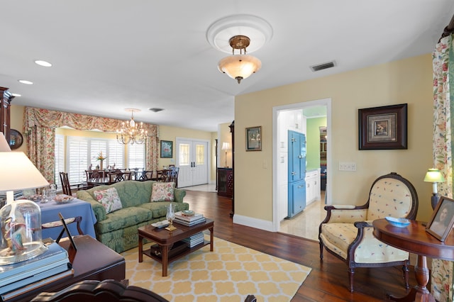 4633 Holly Dr, Palm Beach Gardens, FL 33418 - living area featuring light wood finished floors, a chandelier, baseboards, and recessed lighting