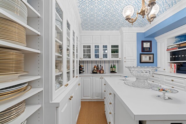 4633 Holly Dr, Palm Beach Gardens, FL 33418 - kitchen featuring open shelves, a chandelier, and white cabinets