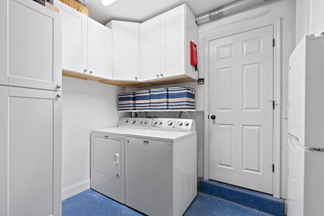 4633 Holly Dr, Palm Beach Gardens, FL 33418 - laundry room with separate washer and dryer and cabinet space