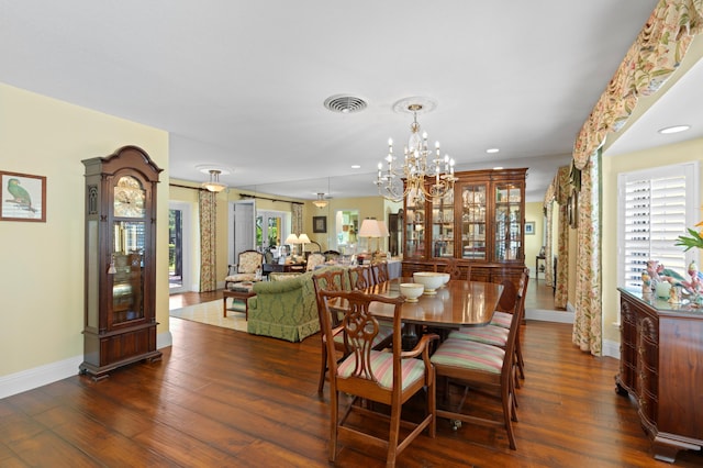 4633 Holly Dr, Palm Beach Gardens, FL 33418 - dining space featuring baseboards, dark wood finished floors, a chandelier, and recessed lighting