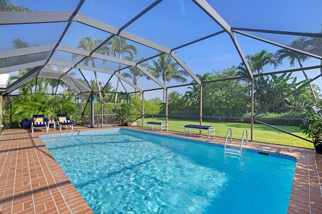 4633 Holly Dr, Palm Beach Gardens, FL 33418 - outdoor pool featuring a lawn, a lanai, and a patio area
