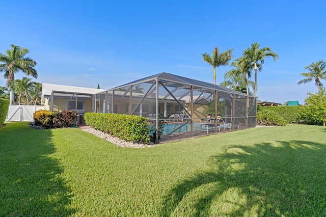 4633 Holly Dr, Palm Beach Gardens, FL 33418 - view of yard with an outdoor pool and a gate