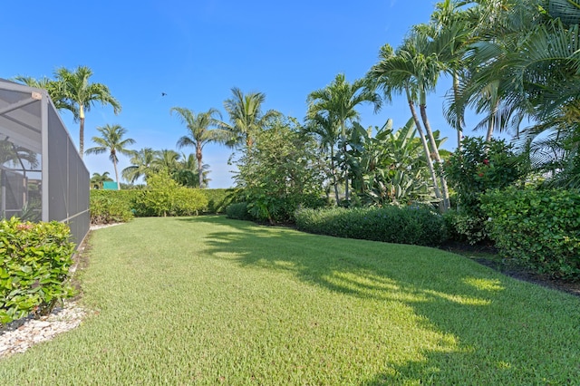 4633 Holly Dr, Palm Beach Gardens, FL 33418 - view of green lawn with glass enclosure