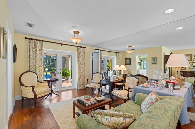4633 Holly Dr, Palm Beach Gardens, FL 33418 - living room featuring french doors, wood-type flooring, baseboards, and recessed lighting