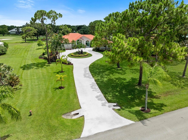 4902 SW Bimini Cir N, Palm City, FL 34990 - view of community with concrete driveway and a yard