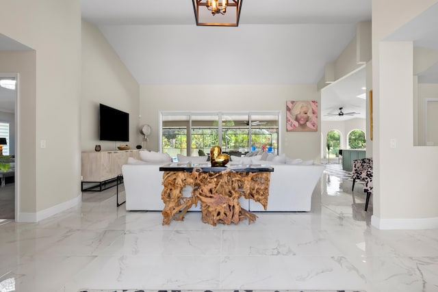 4902 SW Bimini Cir N, Palm City, FL 34990 - living room featuring ceiling fan, light marble finish floors, and high vaulted ceiling