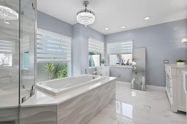 4902 SW Bimini Cir N, Palm City, FL 34990 - full bathroom featuring a chandelier, a garden tub, vanity, recessed lighting, and a shower stall