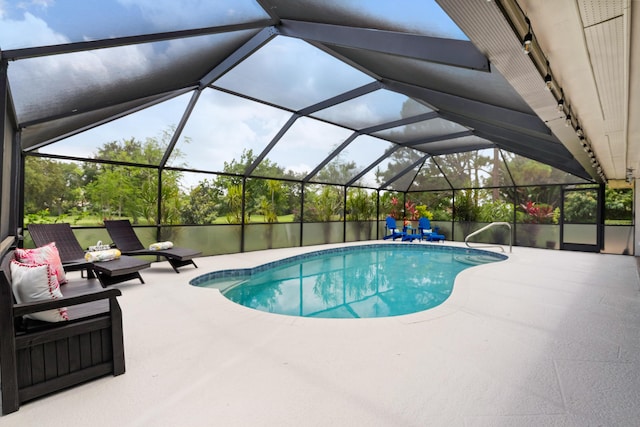 4902 SW Bimini Cir N, Palm City, FL 34990 - swimming pool with a patio area, an outdoor living space, and glass enclosure