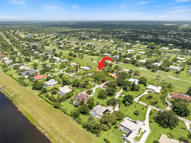 4902 SW Bimini Cir N, Palm City, FL 34990 - aerial overview of property's location featuring a nearby body of water and nearby suburban area