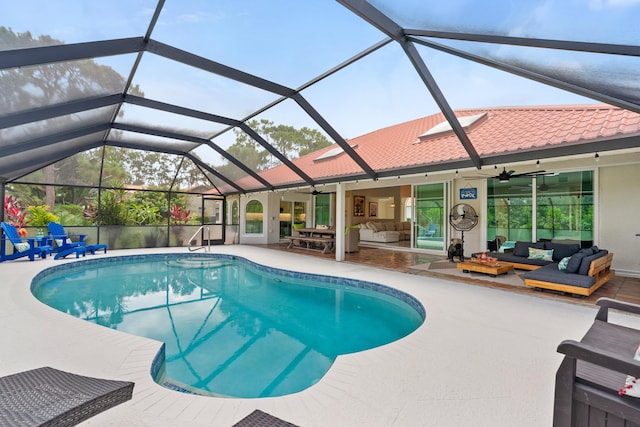 4902 SW Bimini Cir N, Palm City, FL 34990 - swimming pool with outdoor lounge area, a patio area, a ceiling fan, and glass enclosure