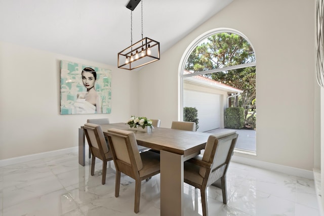 4902 SW Bimini Cir N, Palm City, FL 34990 - dining area featuring light marble finish floors, a chandelier, and lofted ceiling