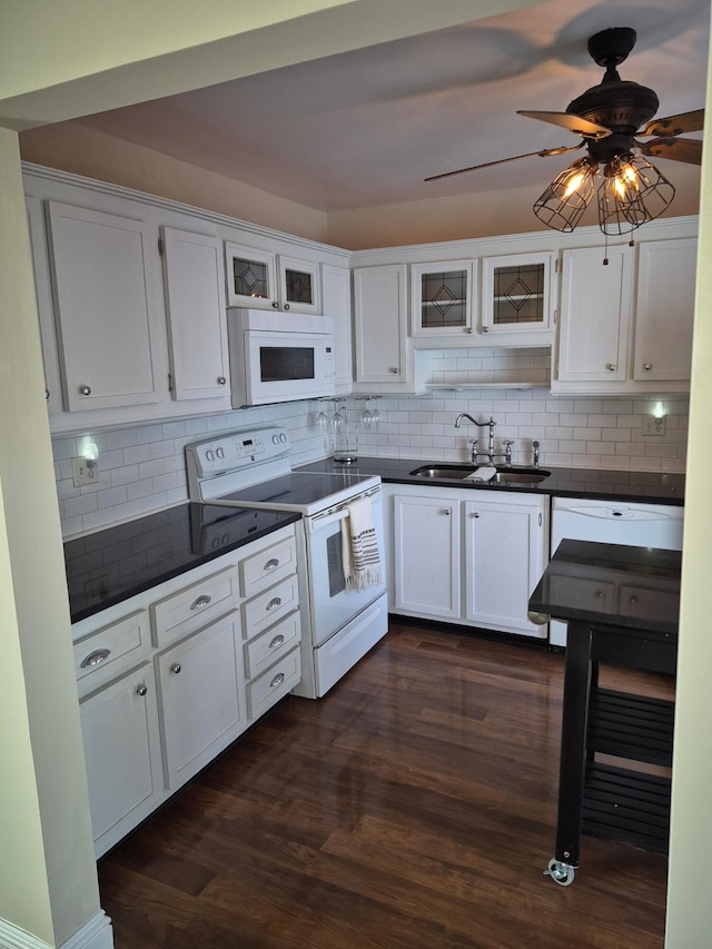 9253 SW 5th St Unit C, Boca Raton, FL 33428 - kitchen featuring white appliances, a sink, dark countertops, and decorative backsplash
