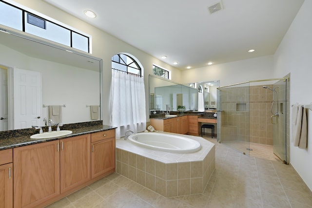 3583 Collonade Dr, Wellington, FL 33449 - full bath with a shower stall, a garden tub, tile patterned flooring, two vanities, and recessed lighting