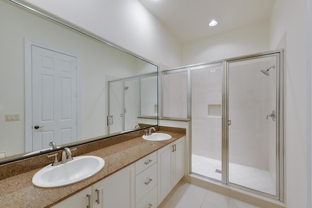 3583 Collonade Dr, Wellington, FL 33449 - bathroom featuring a stall shower, double vanity, and tile patterned floors