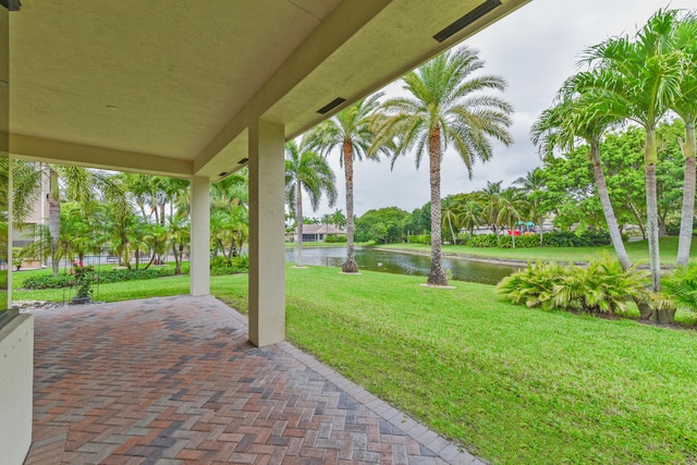 3583 Collonade Dr, Wellington, FL 33449 - view of patio / terrace featuring a water view
