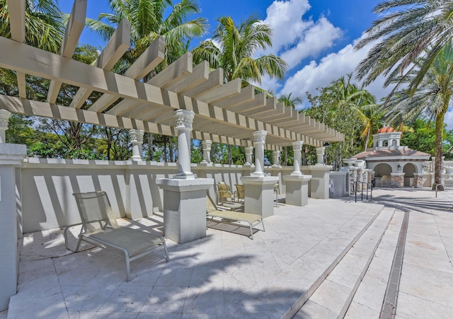 3583 Collonade Dr, Wellington, FL 33449 - view of patio featuring exterior fireplace and a pergola