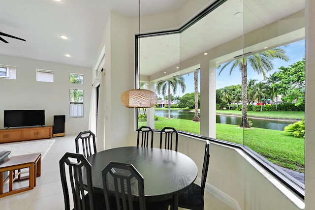 3583 Collonade Dr, Wellington, FL 33449 - dining room with a water view, tile patterned flooring, recessed lighting, baseboards, and ceiling fan