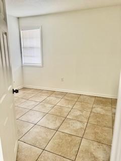 1260 Dr Martin Luther King Jr Blvd, Riviera Beach, FL 33404 - empty room featuring light tile patterned floors