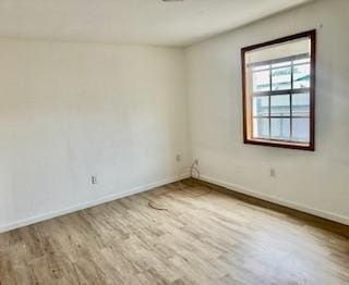 1260 Dr Martin Luther King Jr Blvd, Riviera Beach, FL 33404 - unfurnished room featuring wood finished floors and baseboards