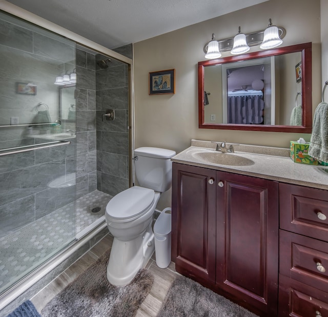 1516 S Lakeside Dr Unit 205, Lake Worth Beach, FL 33460 - full bath with wood finished floors, vanity, and a stall shower