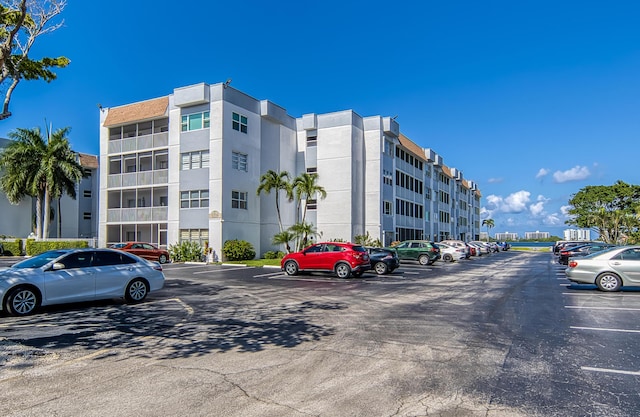 1516 S Lakeside Dr Unit 205, Lake Worth Beach, FL 33460 - view of apartment building / complex featuring uncovered parking