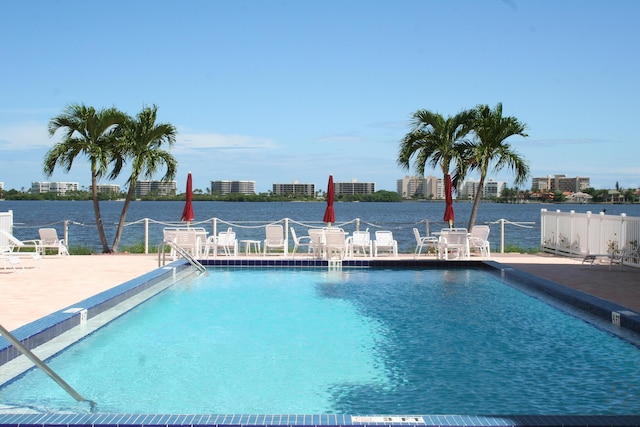 1516 S Lakeside Dr Unit 205, Lake Worth Beach, FL 33460 - community pool with a patio area and a water view