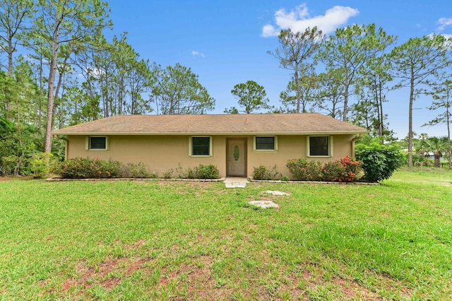 17183 76th St N, Loxahatchee, FL 33470 - single story home with stucco siding and a front lawn