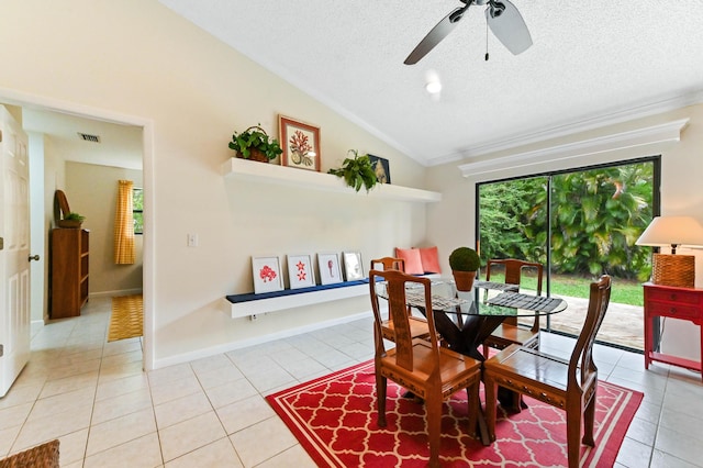 17183 76th St N, Loxahatchee, FL 33470 - dining space featuring vaulted ceiling, a textured ceiling, light tile patterned floors, ornamental molding, and ceiling fan