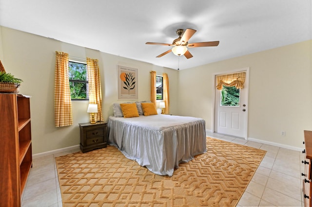 17183 76th St N, Loxahatchee, FL 33470 - bedroom with light tile patterned floors, baseboards, and ceiling fan