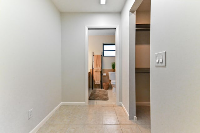 17183 76th St N, Loxahatchee, FL 33470 - hallway featuring light tile patterned floors and baseboards