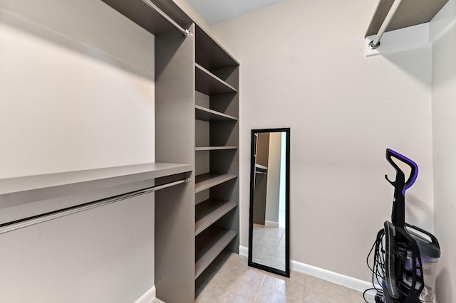 17183 76th St N, Loxahatchee, FL 33470 - walk in closet with light tile patterned floors