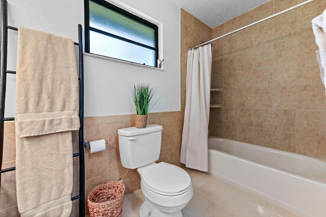 17183 76th St N, Loxahatchee, FL 33470 - full bath with toilet, tile walls, shower / bath combo with shower curtain, tile patterned flooring, and wainscoting