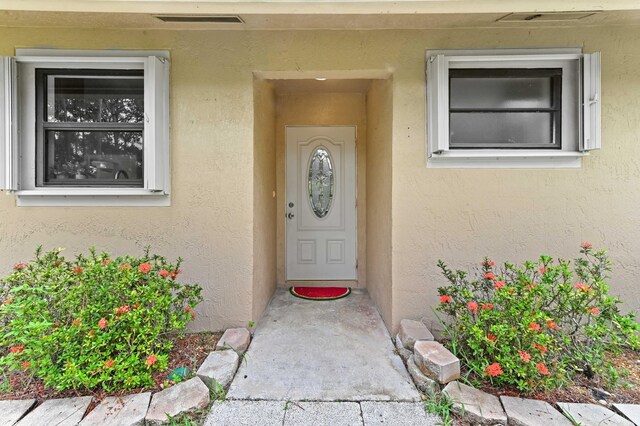 17183 76th St N, Loxahatchee, FL 33470 - property entrance featuring stucco siding