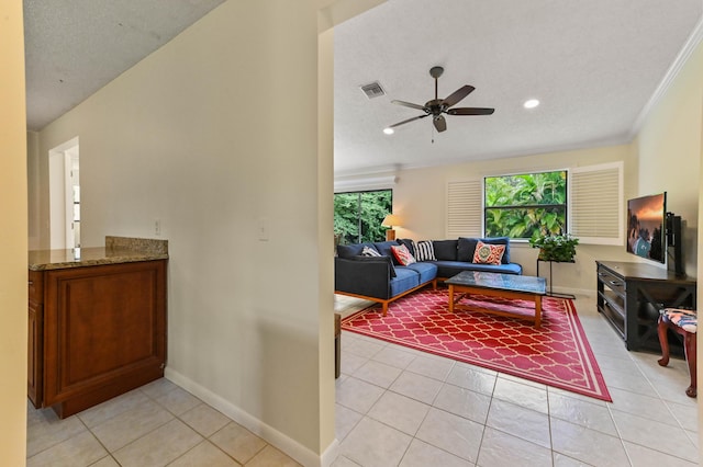 17183 76th St N, Loxahatchee, FL 33470 - living room with a ceiling fan, light tile patterned floors, baseboards, recessed lighting, and ornamental molding