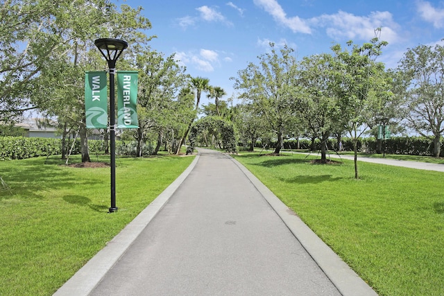 13439 SW River Rock Rd, Port Saint Lucie, FL 34987 - view of community featuring a yard