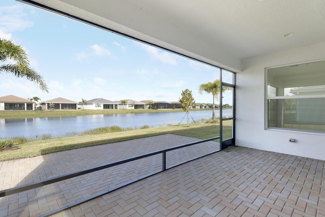 13439 SW River Rock Rd, Port Saint Lucie, FL 34987 - unfurnished sunroom with a water view and a residential view