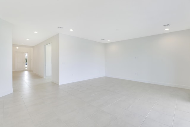 13439 SW River Rock Rd, Port Saint Lucie, FL 34987 - unfurnished room featuring light tile patterned flooring, recessed lighting, and baseboards