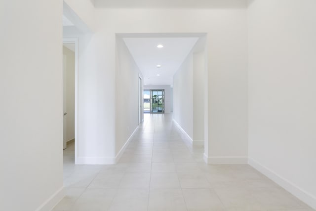 13439 SW River Rock Rd, Port Saint Lucie, FL 34987 - hall with light tile patterned floors, baseboards, and recessed lighting