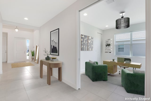 13439 SW River Rock Rd, Port Saint Lucie, FL 34987 - entrance foyer with light tile patterned flooring, plenty of natural light, baseboards, and recessed lighting