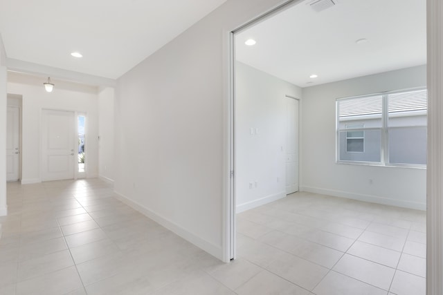 13439 SW River Rock Rd, Port Saint Lucie, FL 34987 - foyer entrance featuring light tile patterned floors, recessed lighting, and baseboards