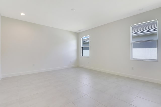 13439 SW River Rock Rd, Port Saint Lucie, FL 34987 - empty room with baseboards and light tile patterned floors