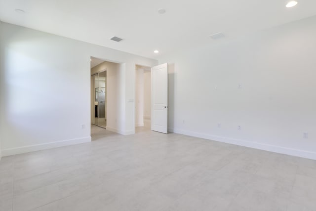 13439 SW River Rock Rd, Port Saint Lucie, FL 34987 - empty room with baseboards and recessed lighting
