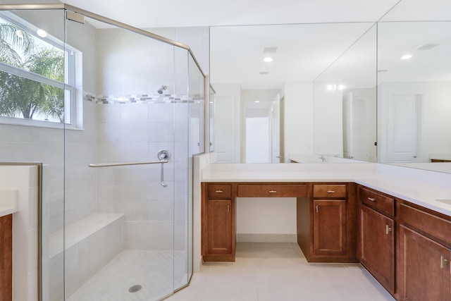 13439 SW River Rock Rd, Port Saint Lucie, FL 34987 - full bath with vanity, a stall shower, tile patterned flooring, and recessed lighting