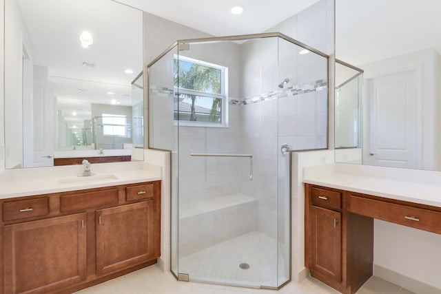 13439 SW River Rock Rd, Port Saint Lucie, FL 34987 - full bath featuring a shower stall, vanity, and tile patterned flooring