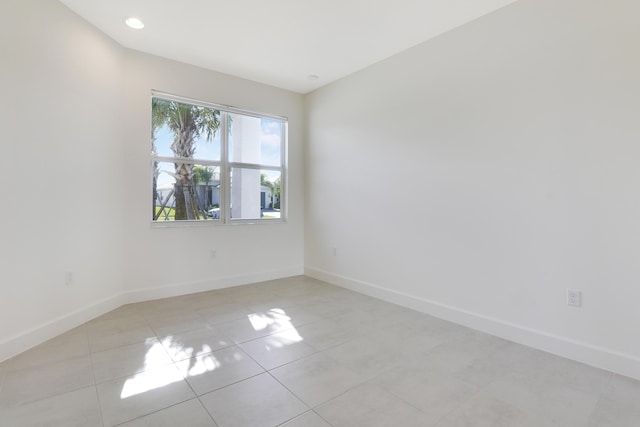 13439 SW River Rock Rd, Port Saint Lucie, FL 34987 - empty room with baseboards and light tile patterned floors
