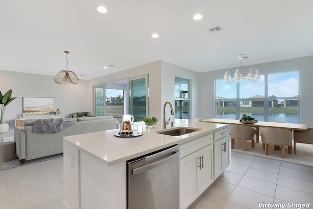 13439 SW River Rock Rd, Port Saint Lucie, FL 34987 - kitchen with stainless steel dishwasher, a sink, light tile patterned flooring, pendant lighting, and recessed lighting