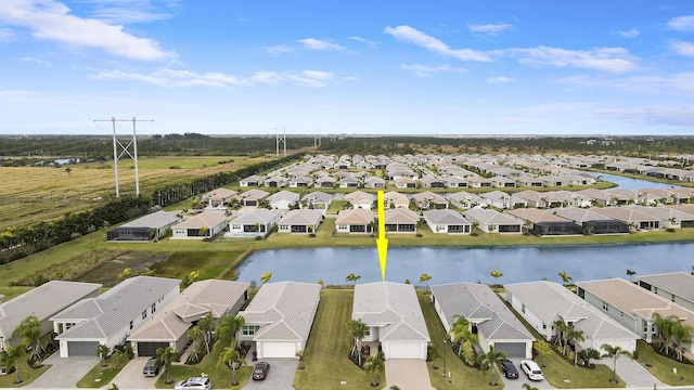13439 SW River Rock Rd, Port Saint Lucie, FL 34987 - aerial perspective of suburban area featuring a large body of water