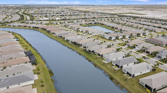 13439 SW River Rock Rd, Port Saint Lucie, FL 34987 - aerial view of residential area with a nearby body of water