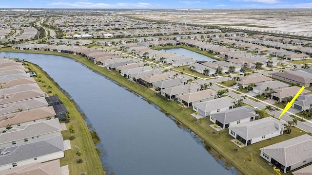 13439 SW River Rock Rd, Port Saint Lucie, FL 34987 - aerial view of residential area with a large body of water