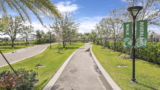 13439 SW River Rock Rd, Port Saint Lucie, FL 34987 - view of home's community with a yard